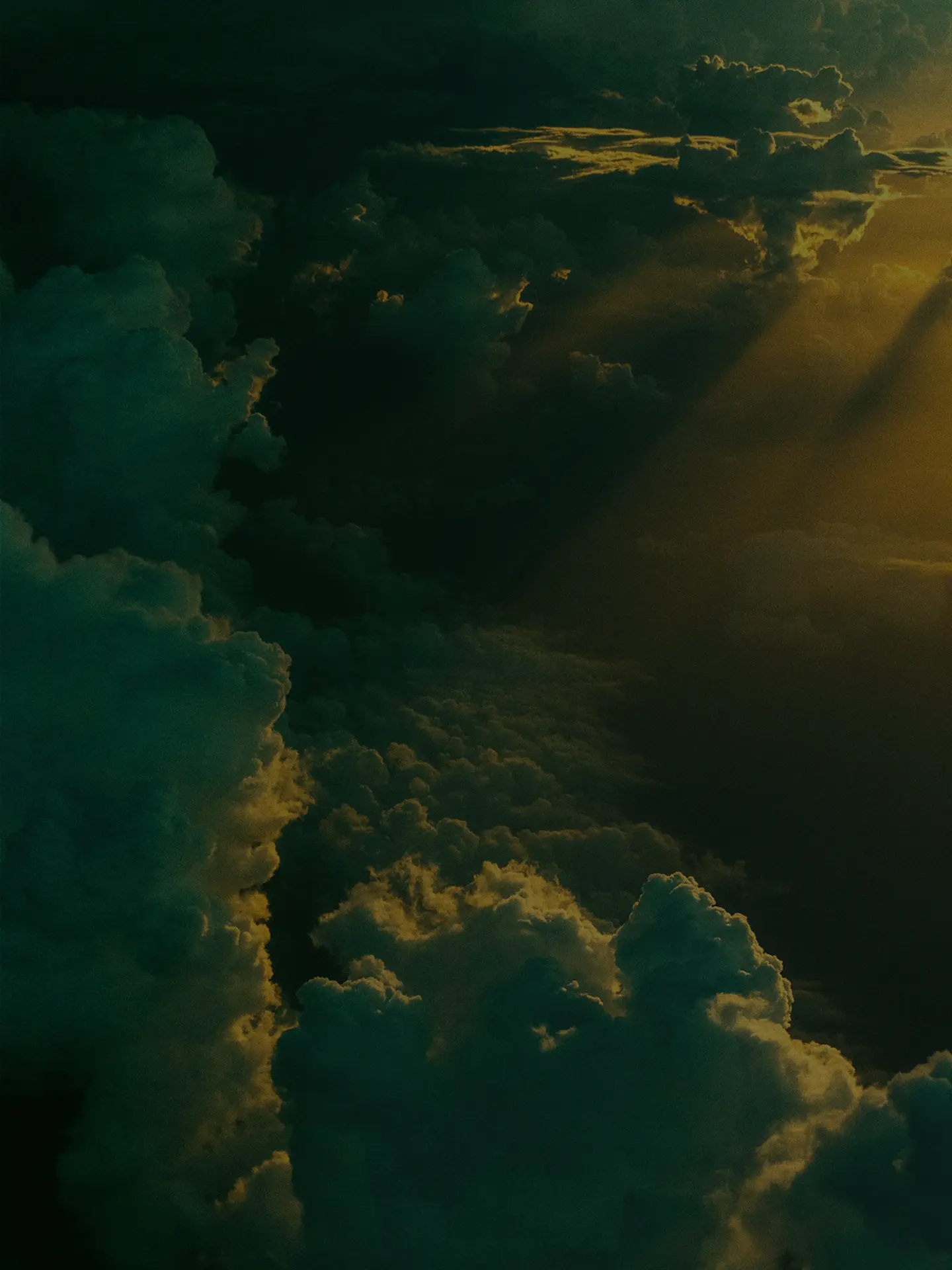 Dark clouds with golden sunlight breaking through